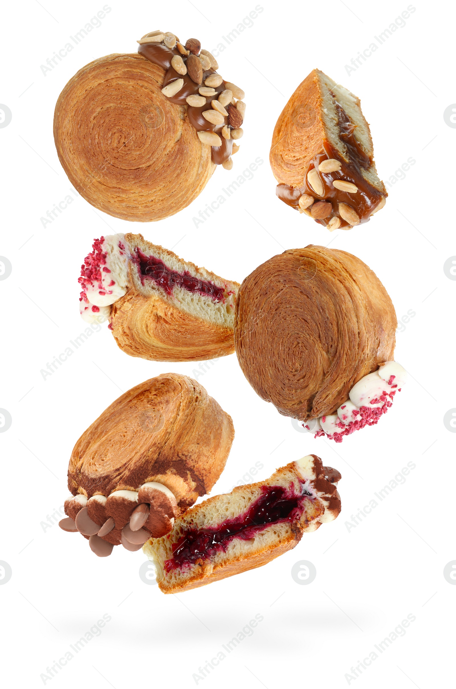 Image of Delicious round croissants in air on white background. Puff pastry