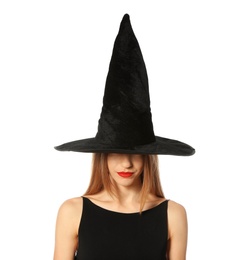 Photo of Beautiful young woman wearing witch costume for Halloween party on white background