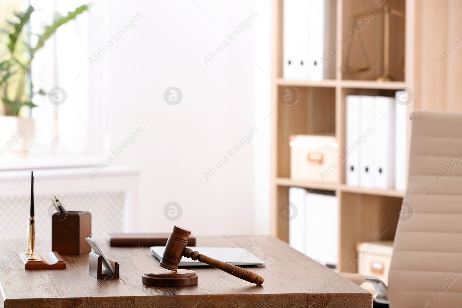 Photo of Table with judge gavel in lawyer's office