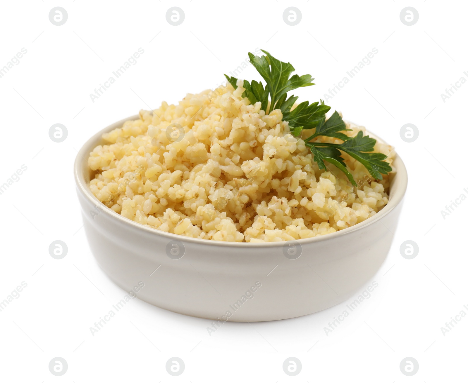 Photo of Delicious bulgur with parsley in bowl isolated on white