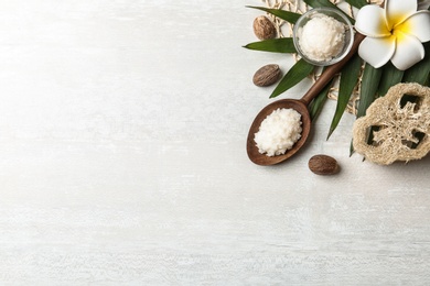 Photo of Flat lay composition with Shea butter and nuts on light background. Space for text