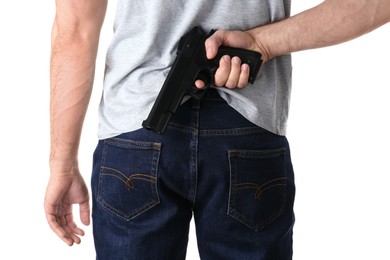 Photo of Man holding gun behind his back on white background, closeup