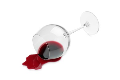 Photo of Overturned glass and spilled wine on white background