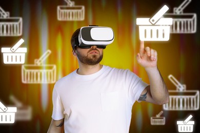 Virtual shopping. Man using VR headset on color background