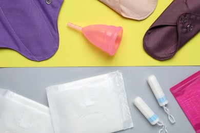 Photo of Different menstrual hygiene products on color background, flat lay
