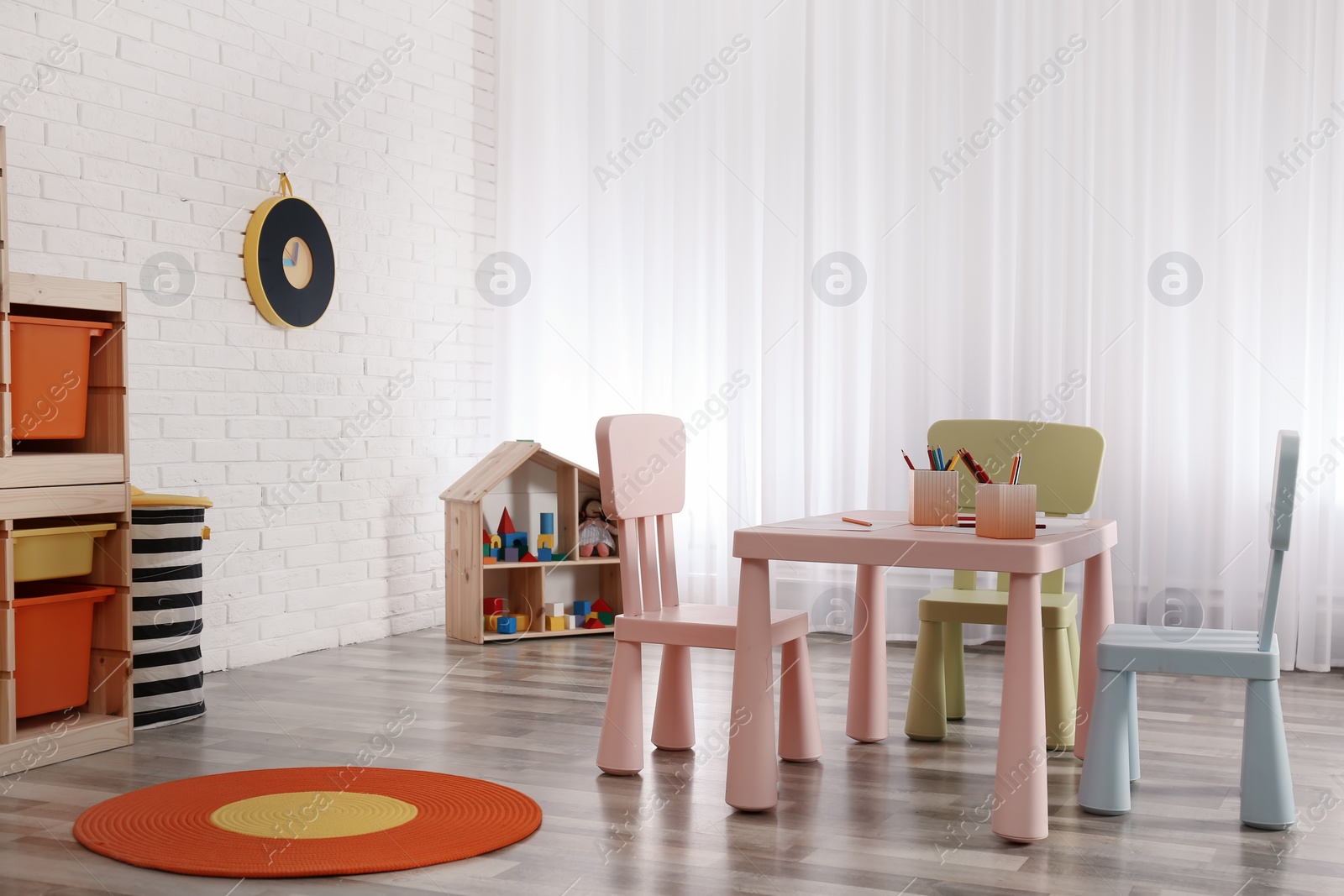 Photo of Modern child room interior with table and chairs