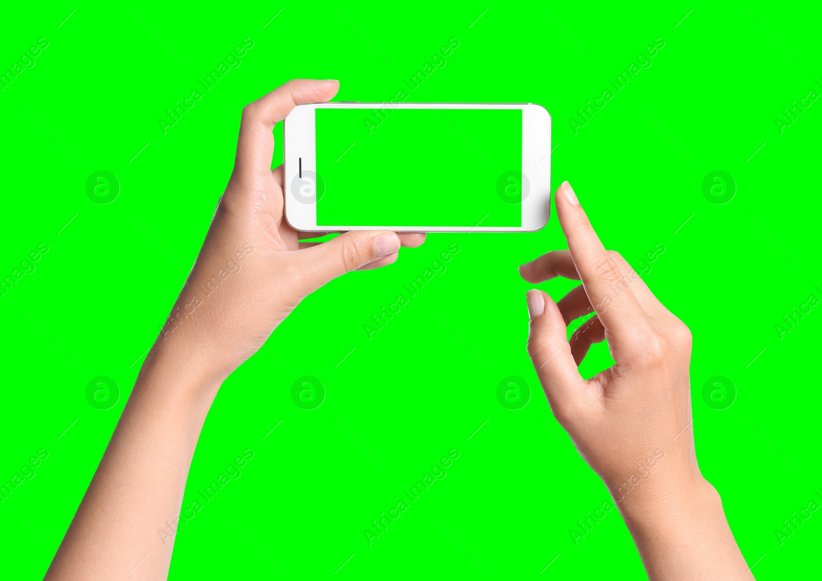 Image of Young woman holding smartphone with green screen on color background, closeup. Mockup for design