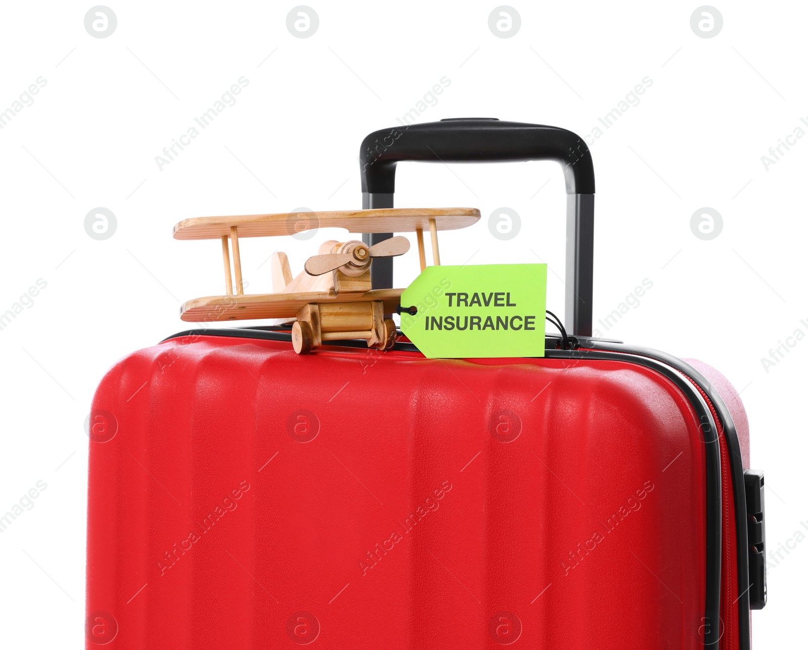 Photo of Red suitcase with TRAVEL INSURANCE label on white background, closeup