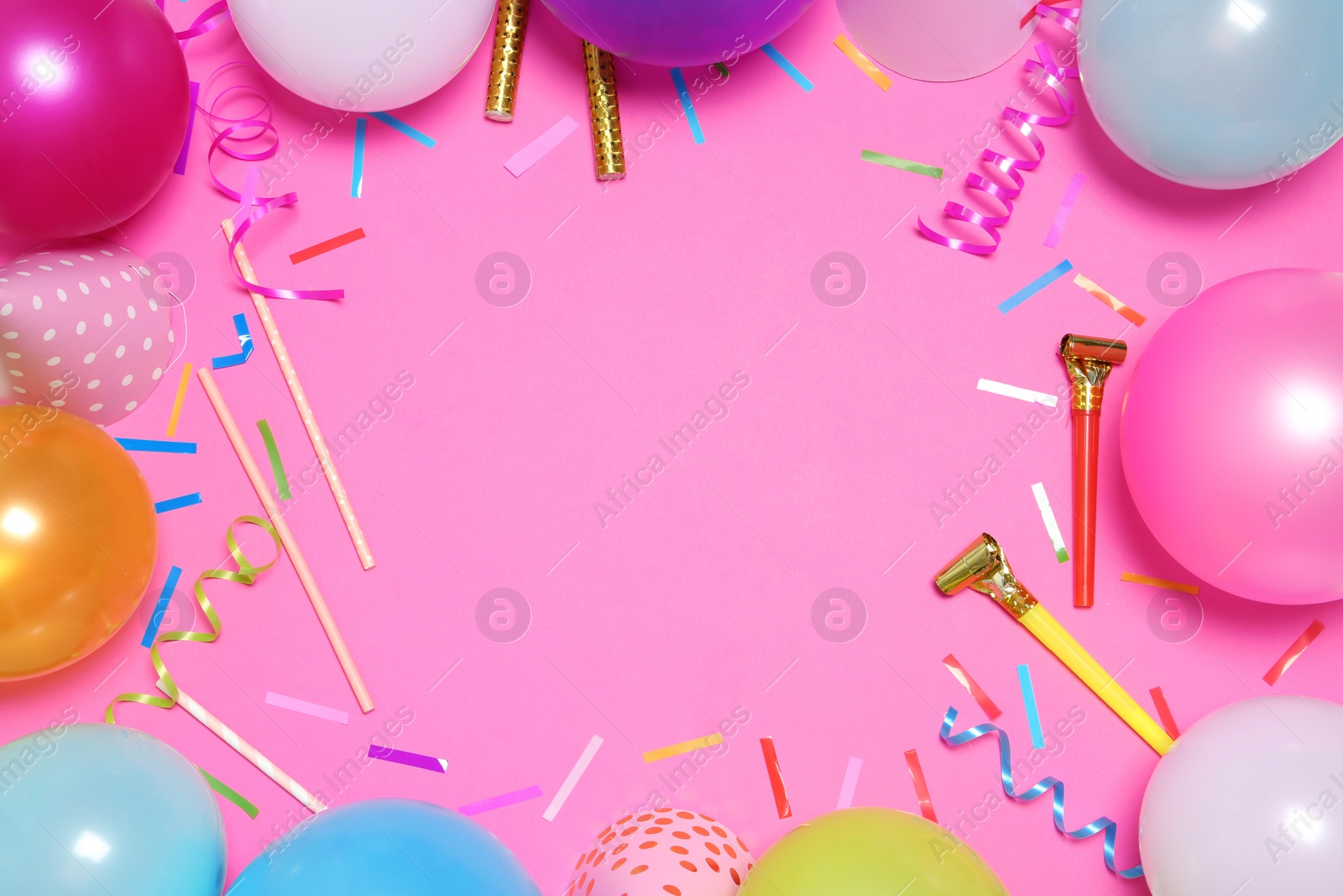 Photo of Frame made of balloons and party accessories on color background, top view with space for text