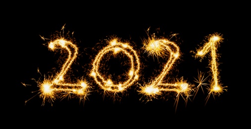 Image of Happy new year card. 2021 silhouettes made of sparkler on black background