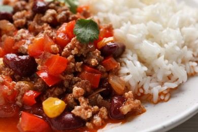 Photo of Plate of rice with chili con carne, closeup view