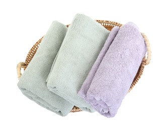 Photo of Basket with different soft towels isolated on white, top view