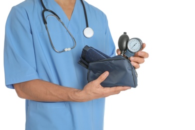 Photo of Male doctor holding blood pressure meter on white background, closeup. Medical object