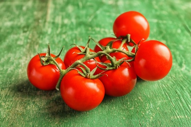 Fresh ripe red tomatoes on wooden table