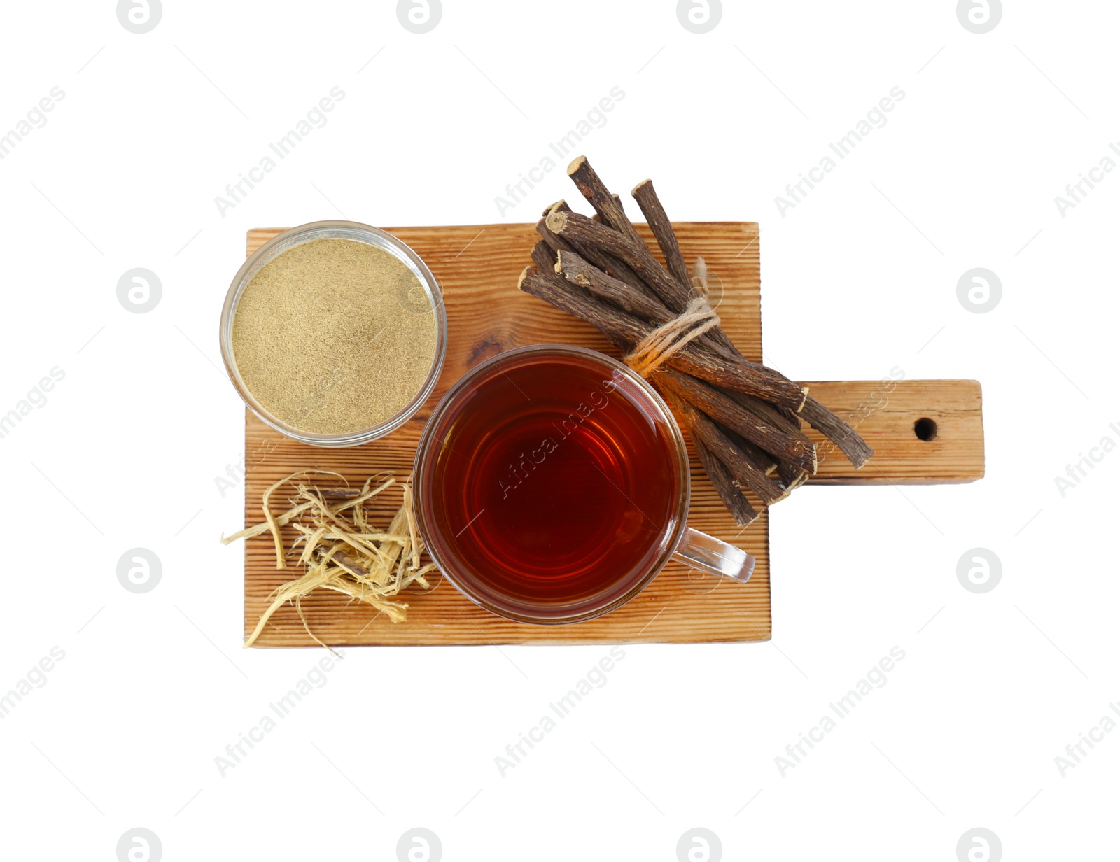 Photo of Aromatic licorice tea in cup, dried sticks of licorice root and powder isolated on white, top view