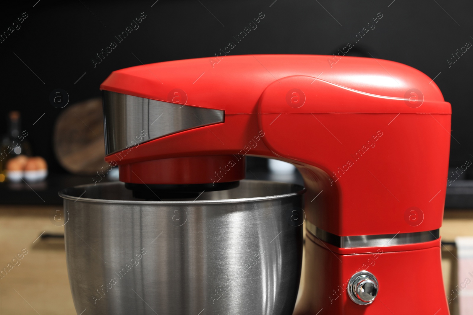 Photo of Modern stand mixer in kitchen, closeup. Home appliance