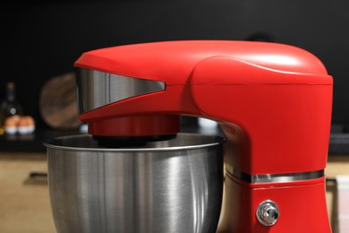 Photo of Modern stand mixer in kitchen, closeup. Home appliance