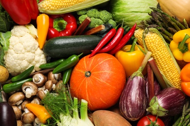 Photo of Different fresh vegetables as background, closeup view