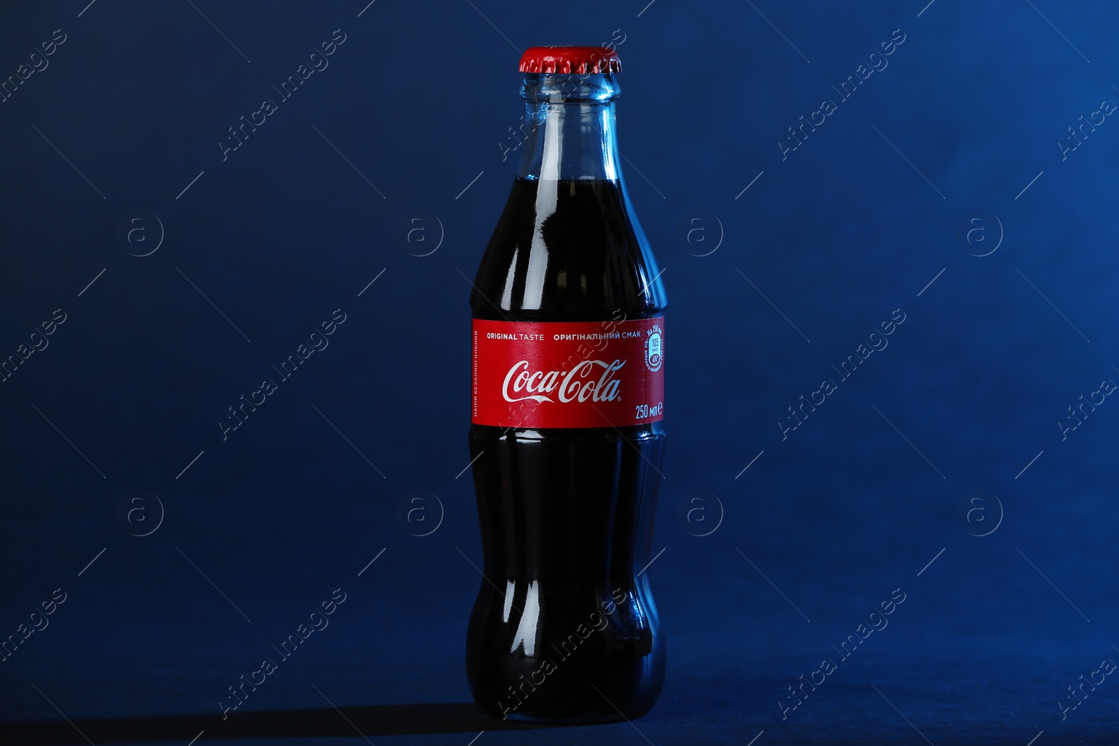 Photo of MYKOLAIV, UKRAINE - NOVEMBER 14, 2018: Bottle of Coca-Cola on dark background