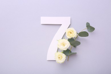 Photo of Paper number 7, beautiful flowers and eucalyptus branch on light grey background, top view