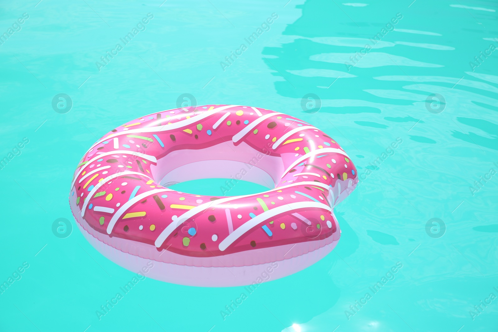 Photo of Inflatable ring in swimming pool on sunny day