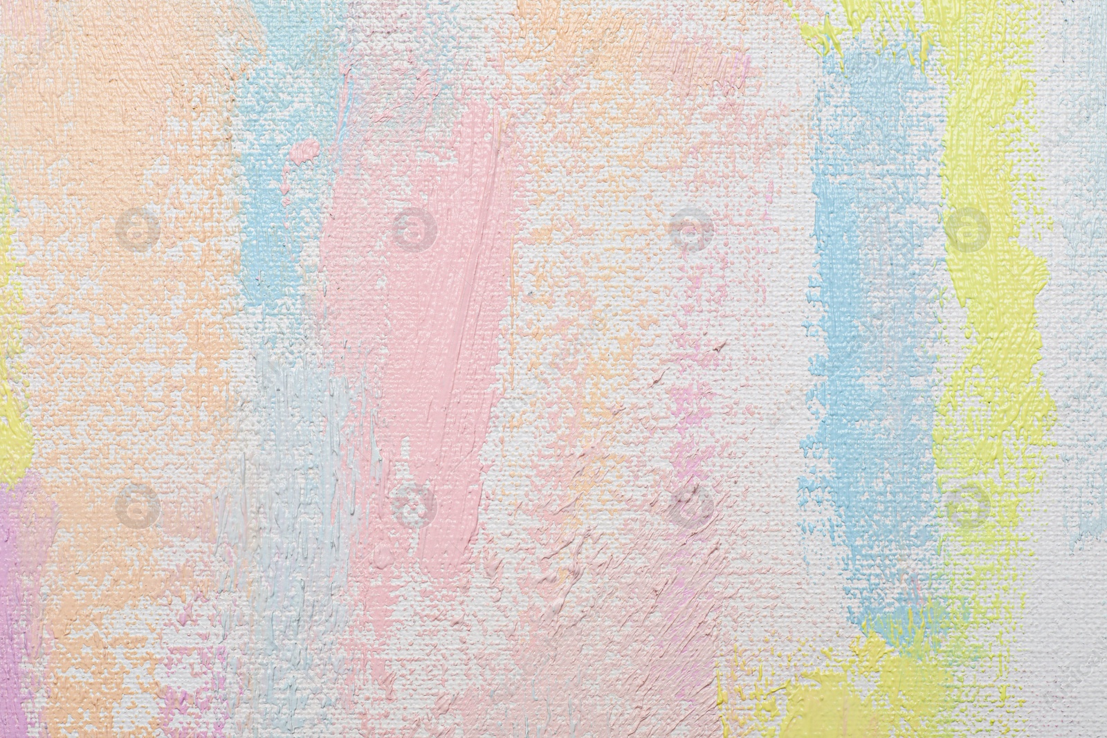 Photo of Strokes of different pastel acrylic paints on white canvas, closeup