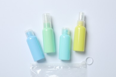 Cosmetic travel kit on white background, flat lay. Bath accessories