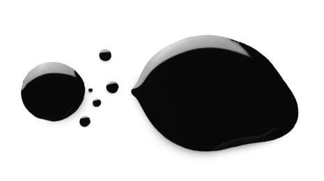 Blobs of black oil isolated on white, top view