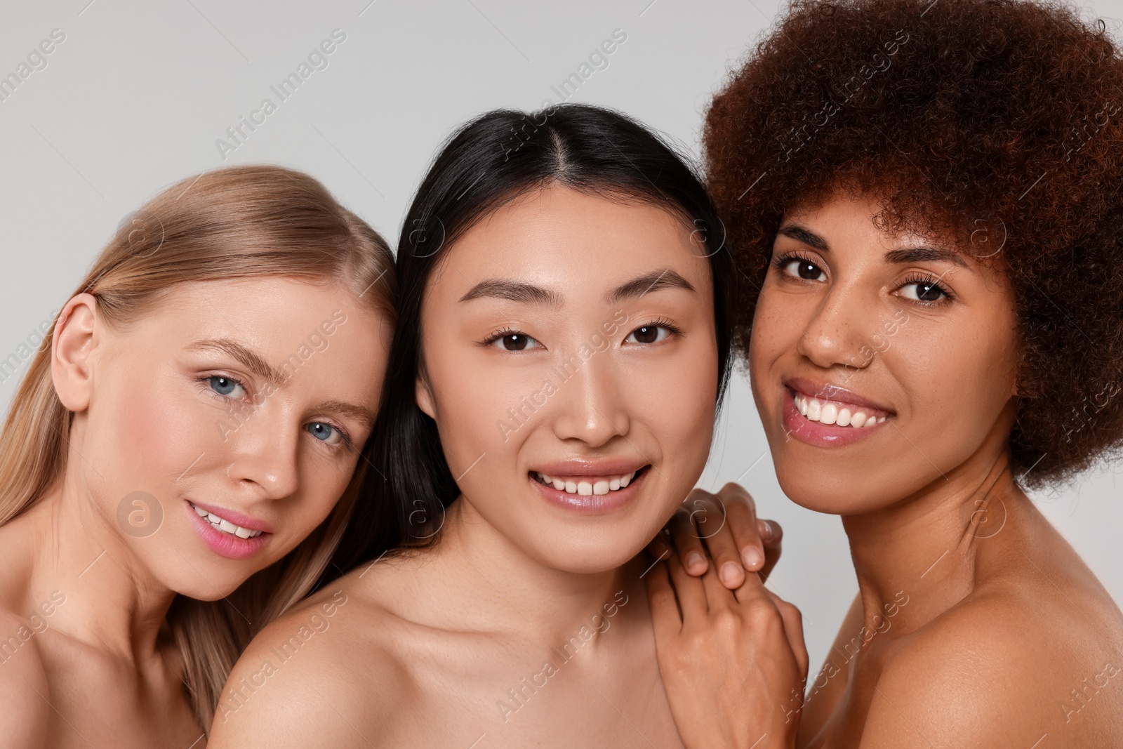 Photo of Portrait of beautiful young women on light grey background