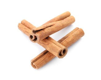 Photo of Aromatic cinnamon sticks on white background