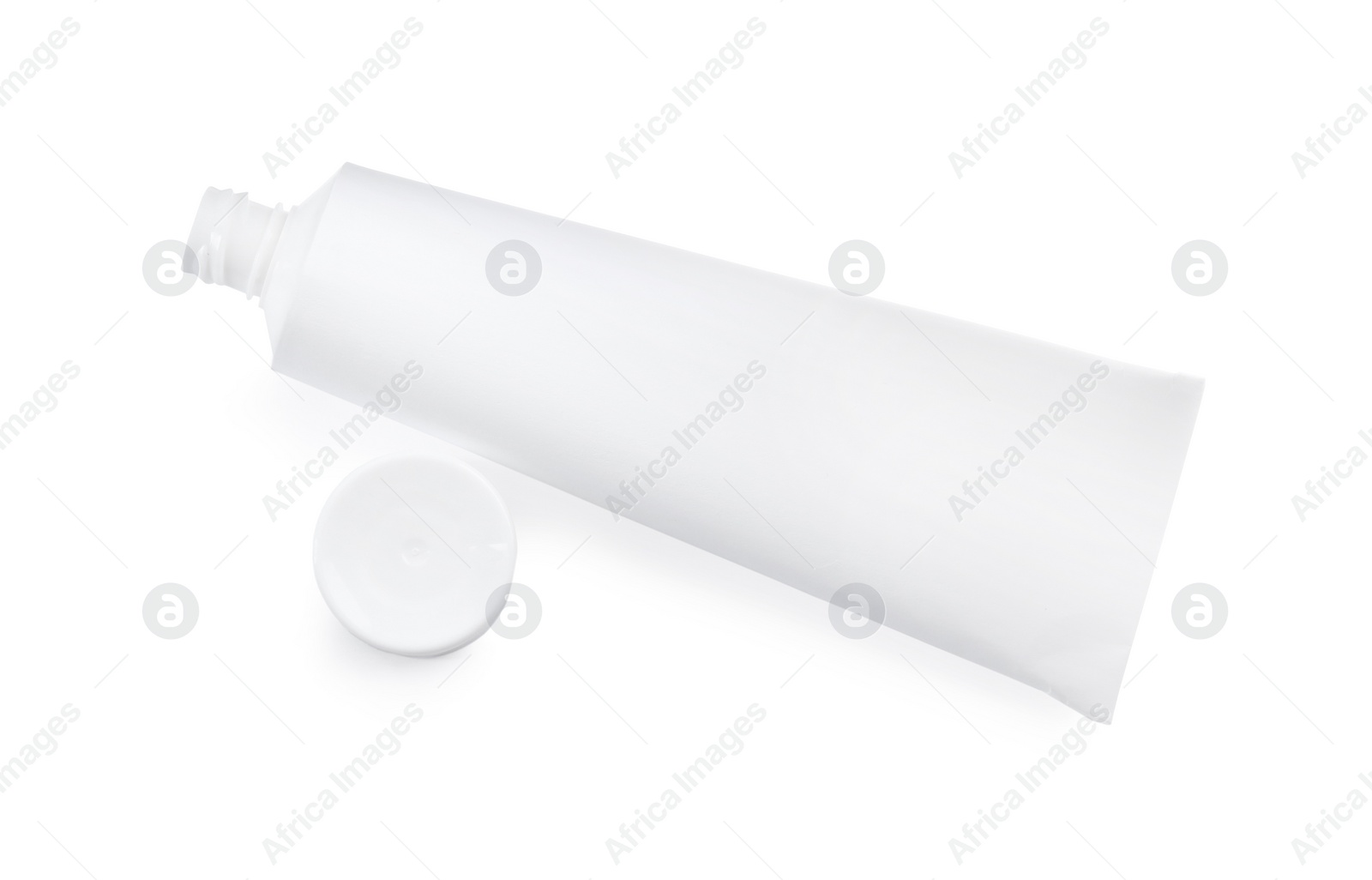 Photo of Blank tube of toothpaste isolated on white, above view