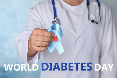 Doctor holding light blue ribbon with paper blood drop as diabetes awareness symbol on color background, closeup