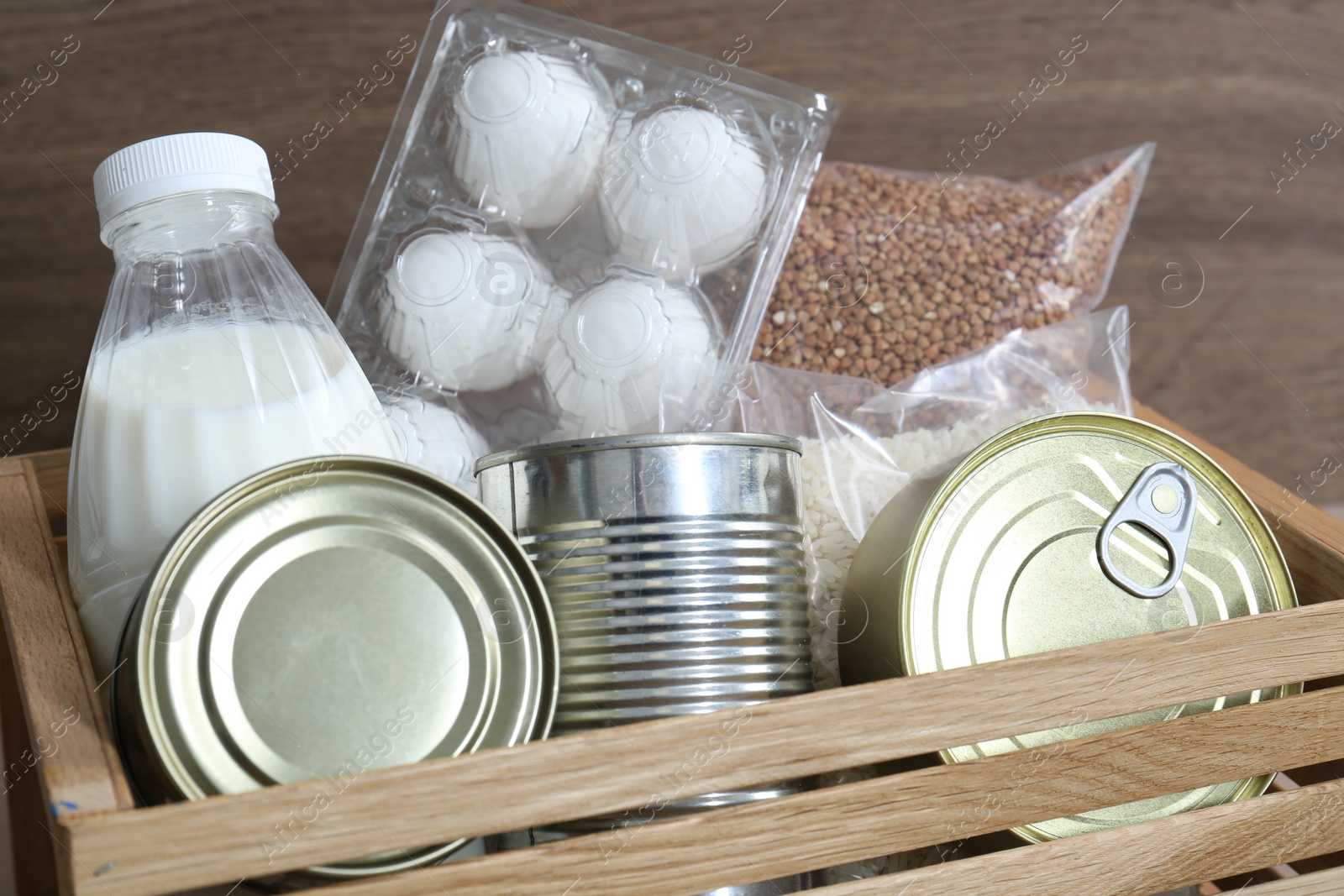 Photo of Donation box with different food products, closeup