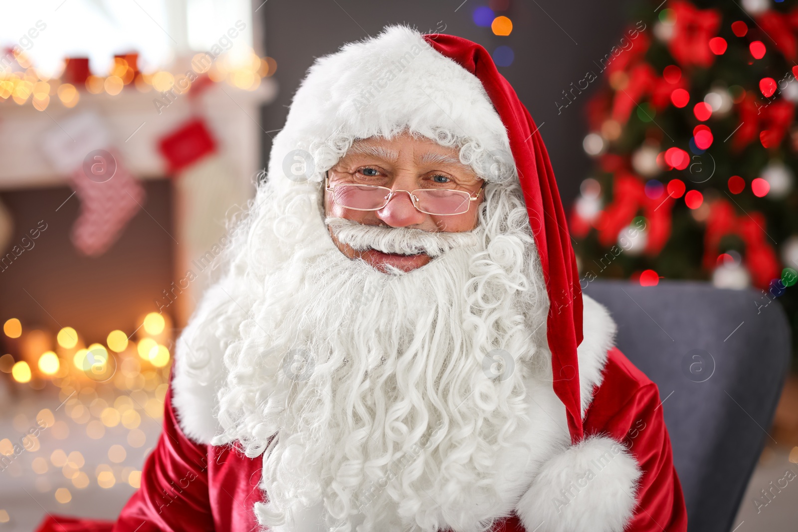 Photo of Authentic Santa Claus in traditional costume indoors