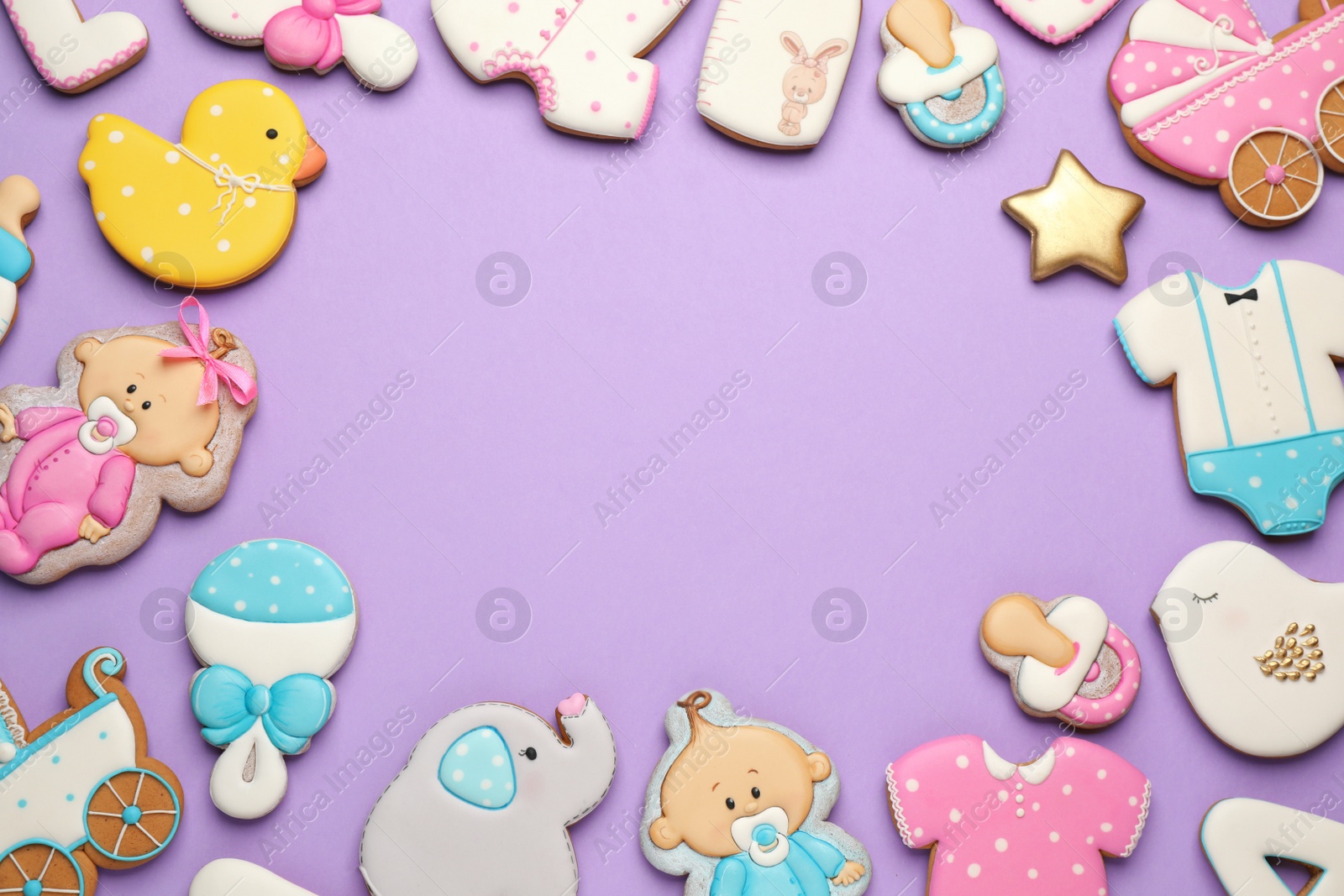 Photo of Frame of baby shower cookies on lilac background, flat lay. Space for text