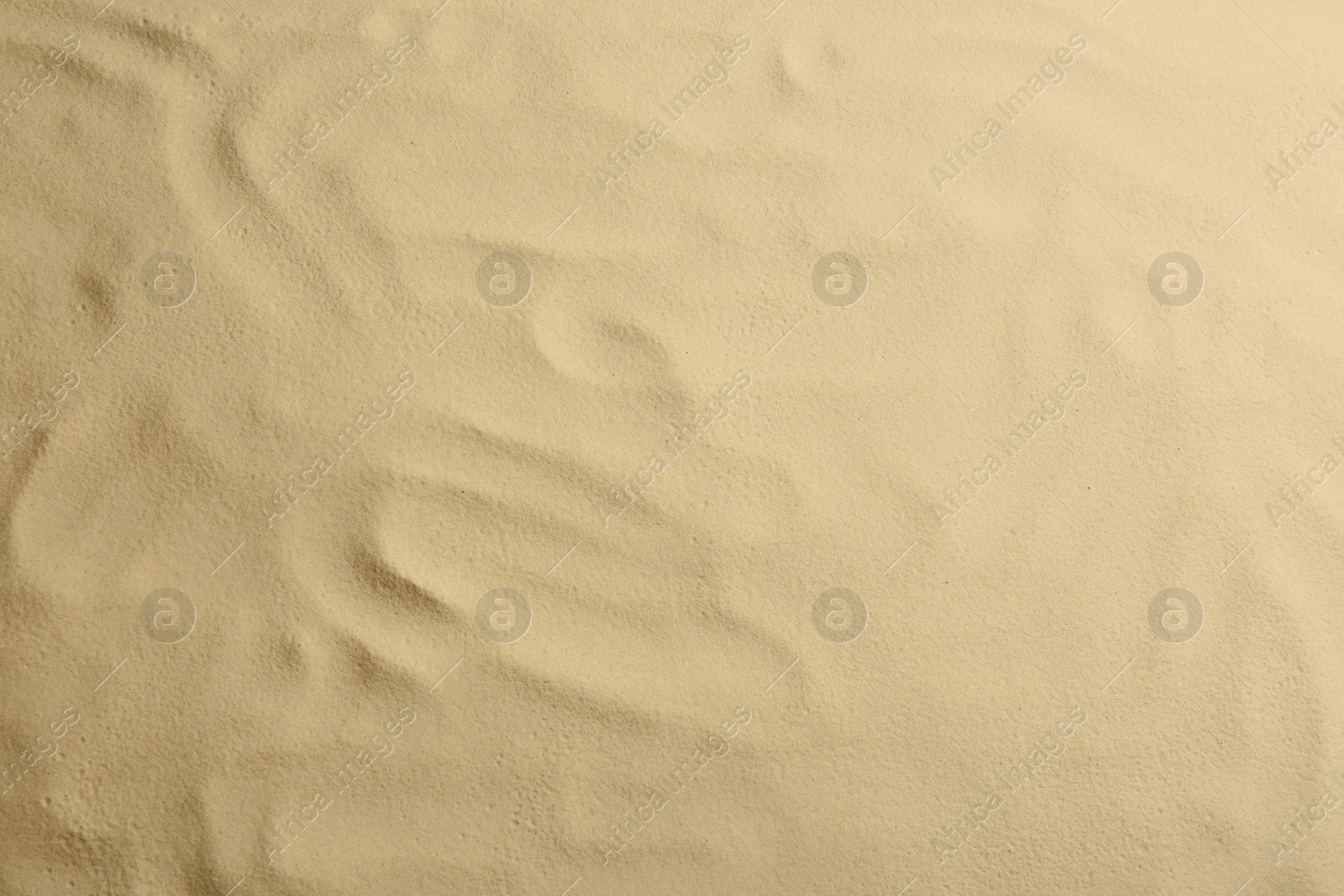 Photo of Dry beach sand as background, top view