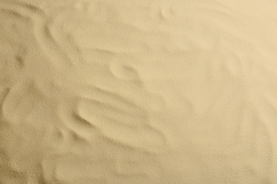 Photo of Dry beach sand as background, top view