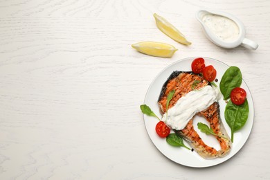 Tasty salmon steak on white wooden table, flat lay. Space for text