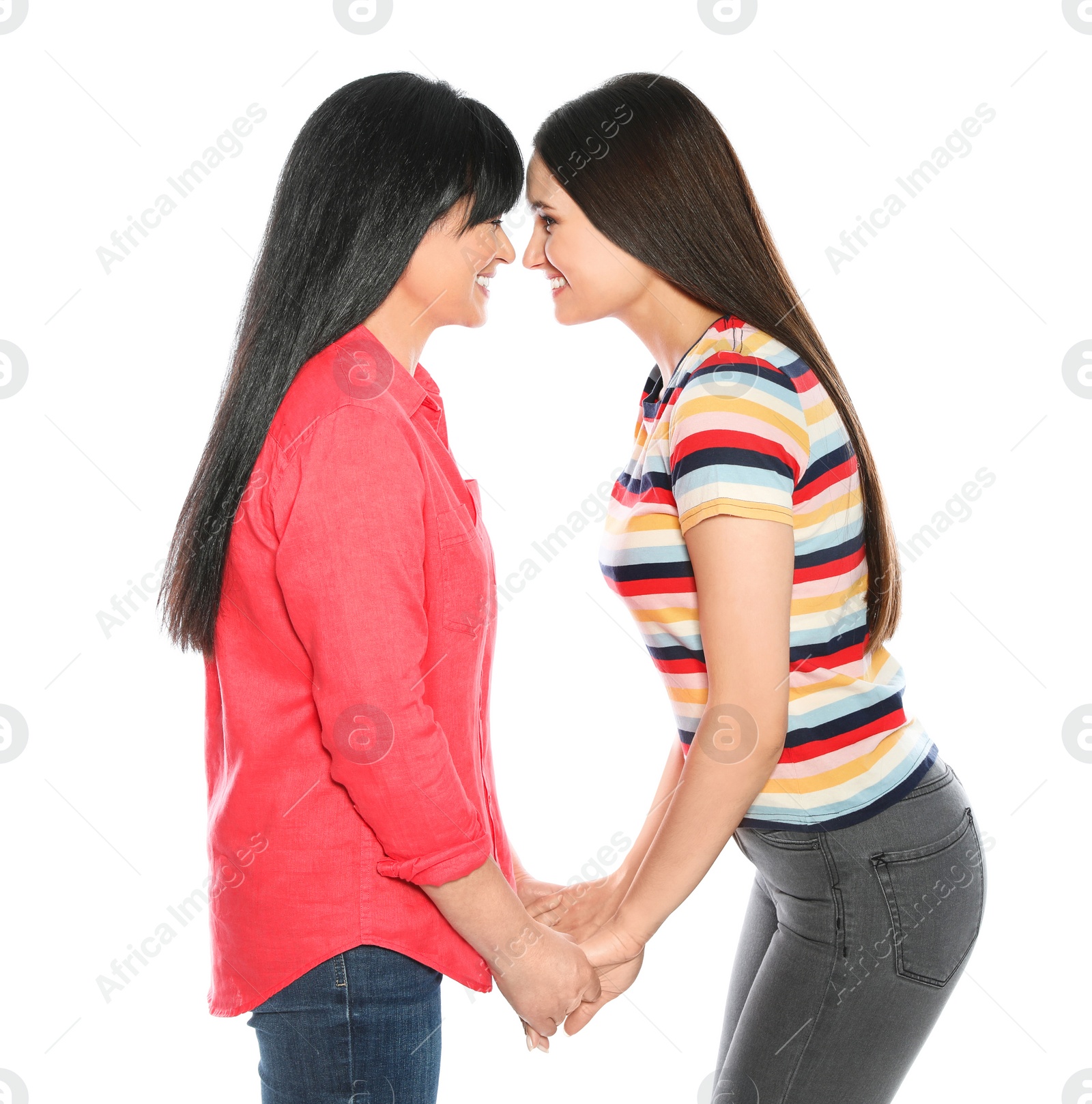 Photo of Portrait of young woman and her mature mother on white background