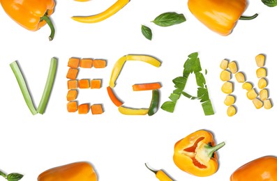 Image of Word VEGAN made of different fresh tasty vegetables on white background, flat lay