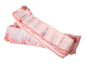 Photo of Raw pork ribs isolated on white, top view