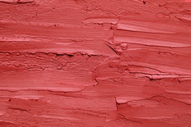 Photo of Texture of bright lipstick as background, top view