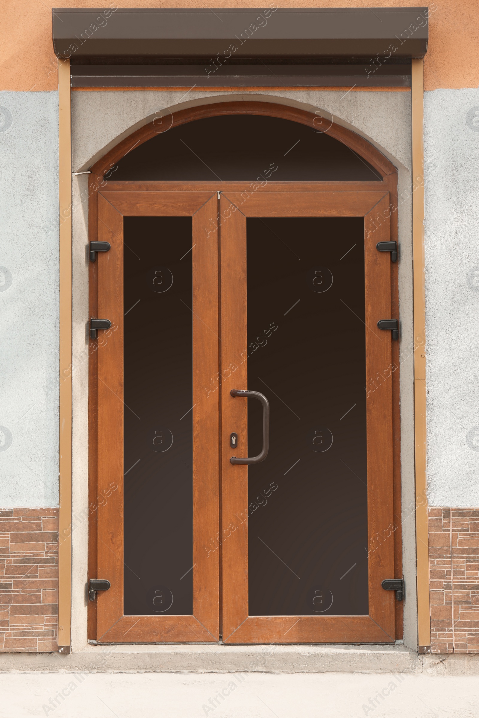 Photo of Building entrance with brown modern external door