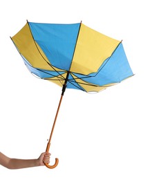 Woman with umbrella caught in gust of wind on white background, closeup