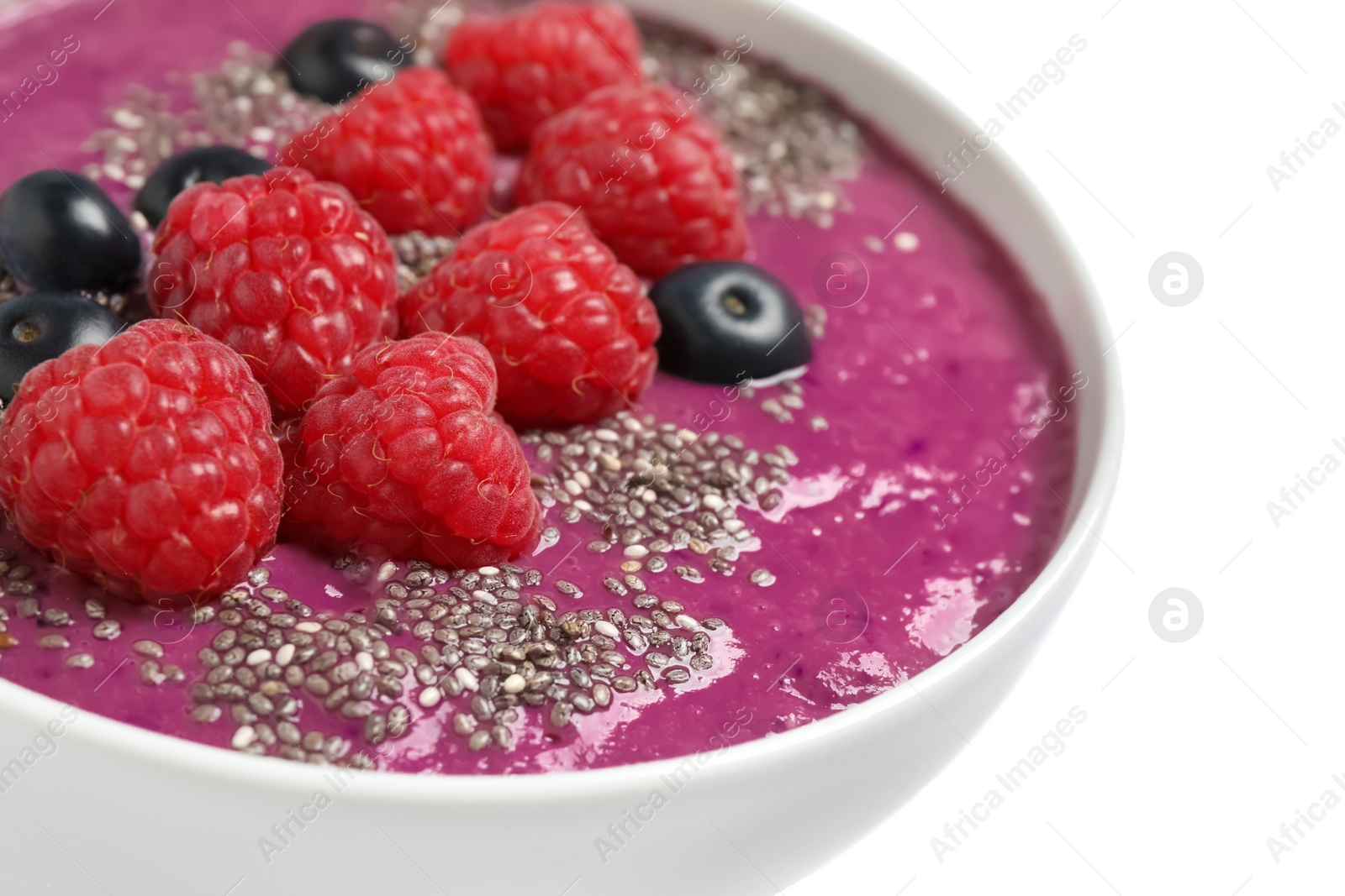 Photo of Healthy breakfast with delicious acai smoothie and fruits in bowl on white background, closeup