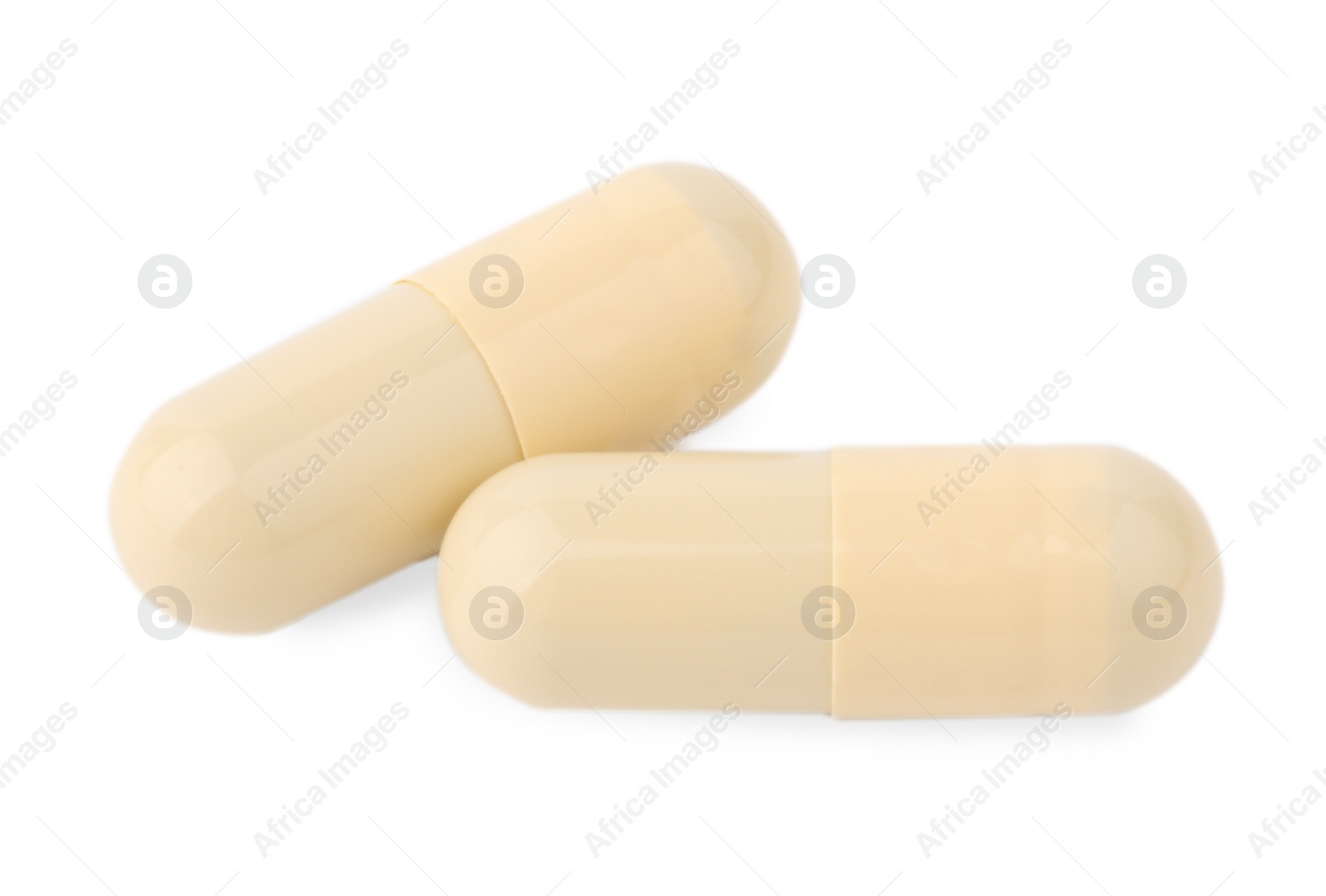 Photo of Vitamin capsules isolated on white, top view