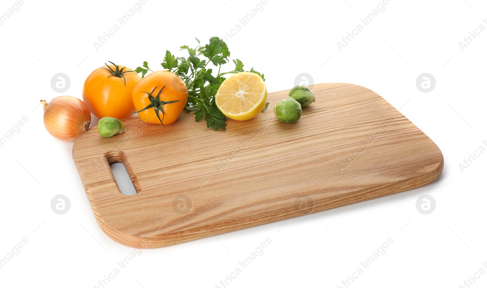 Photo of Wooden cutting board with different fresh vegetables isolated on white