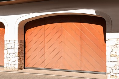 Modern counterweight garage doors on white building