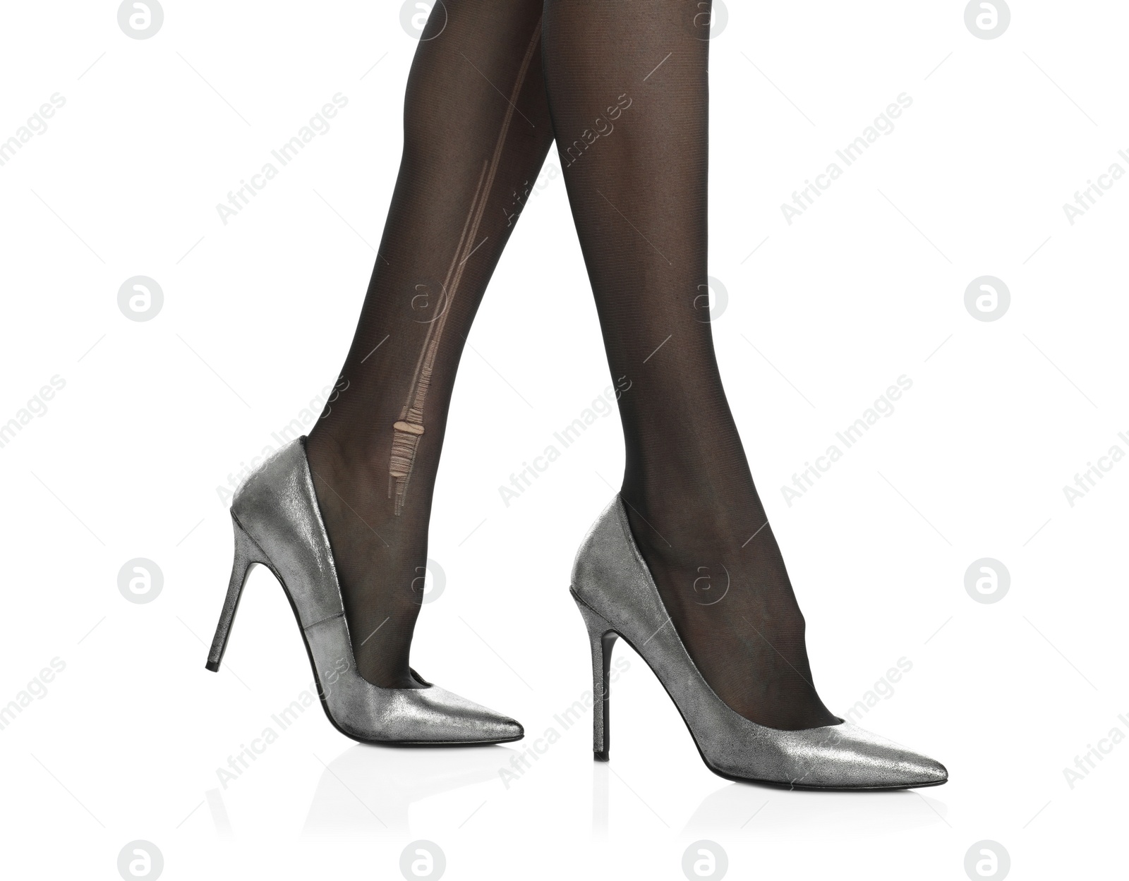 Photo of Woman wearing torn tights on white background, closeup