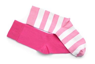 Photo of Different pink socks on white background, top view